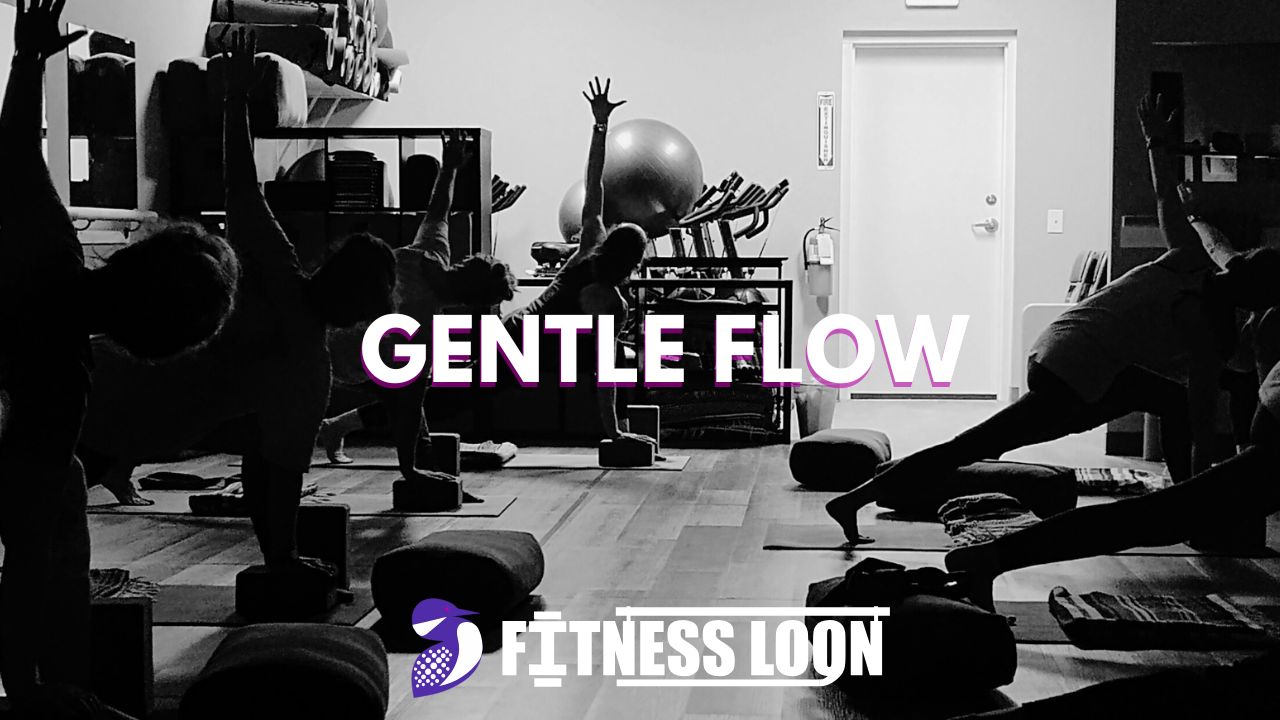 Yoga class performing gentle flow in studio